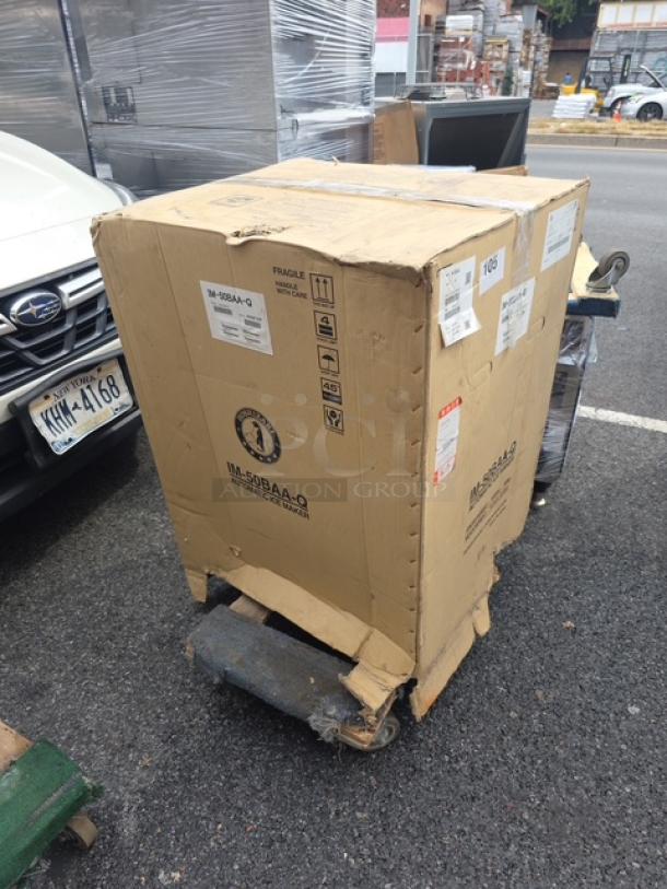 Hoshizaki IM-50BAA-Q sphere ice maker in original, slightly damaged box. Model: IM-50BAA-Q, SN: K008720F.