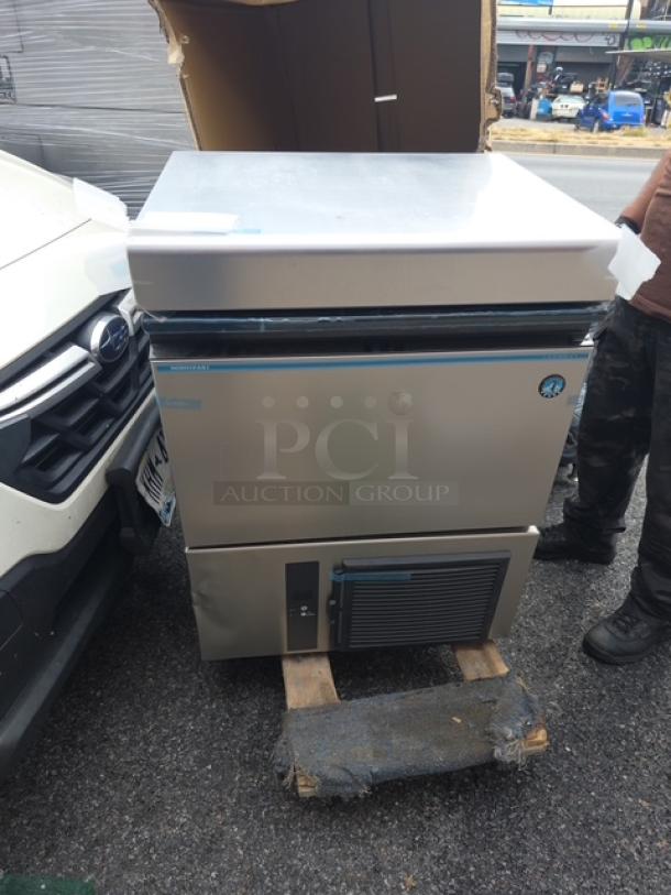 Hoshizaki IM50BAAQ ice maker/storage bin combo, stainless steel, air-cooled, scratch-n-dent condition, model number visible.
