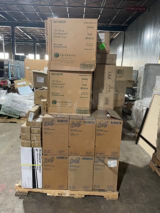 Mixed pallet with Scott paper towels, Greenware drink cups, eyewear, C.A.C. platter, and F.O.H. holder in warehouse.
