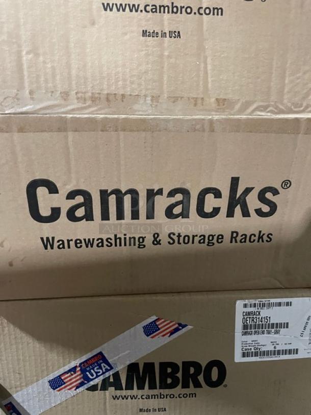 Brand new Cambro Camracks Series tray racks, model OETR314151, in unopened packaging. Each box contains six racks.