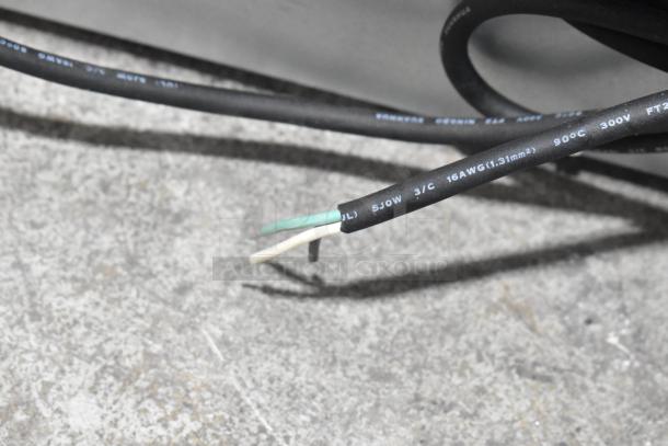 Close-up of power cord wires for 2023 Manitowoc UDF0310A-261Z ice machine; 16 AWG 3/C cable; green, white, and black wires visible.