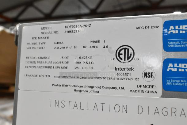 Close-up of the label on a 2023 Manitowoc UDF0310A-261Z ice machine, showing model, voltage, refrigerant info, and certifications.