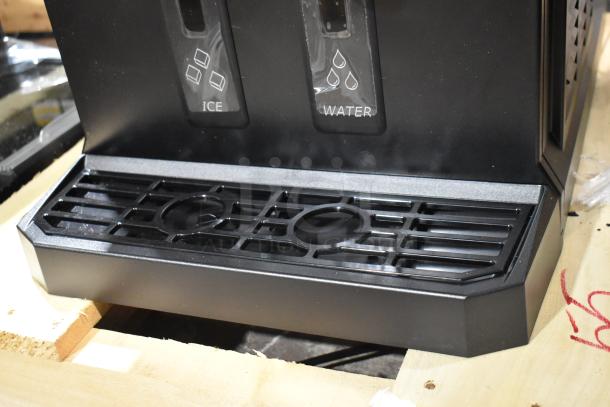 Scotsman HID207AX-1A compact nugget ice machine, touch-free dispensing, new condition, ice and water labels visible.
