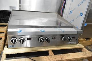 Brand new Garland GTGG36-GT36M stainless steel 36" natural gas griddle with thermostatic controls; 84,000 BTU.