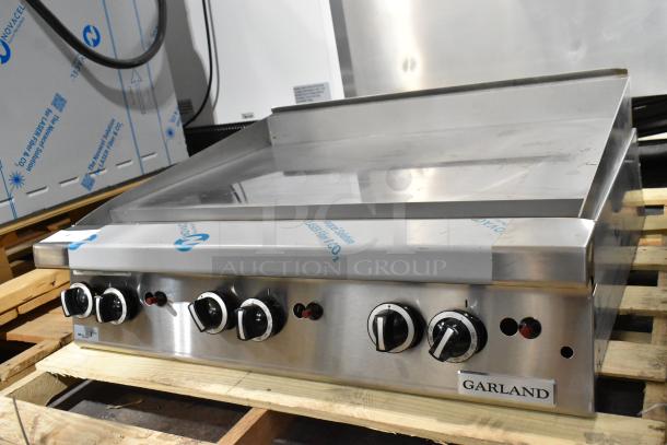 BRAND NEW Garland GTGG36-GT36M 36" stainless steel commercial countertop griddle, 84,000 BTU, thermostatic controls.