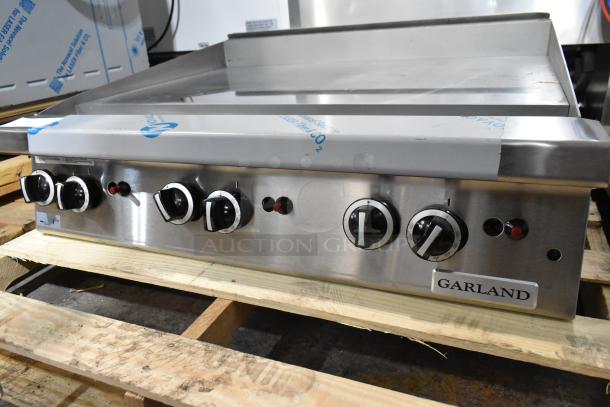 Brand new Garland GTGG36-GT36M 36" stainless steel gas griddle with thermostatic controls, 84,000 BTU. Slight scratches.