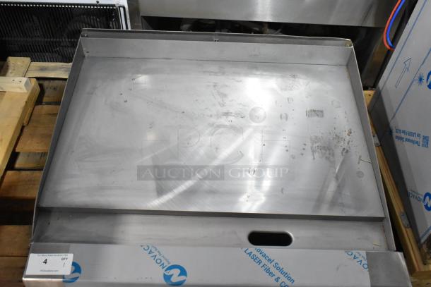Brand new Garland GTGG36-GT36M 36" stainless steel griddle with thermostatic controls, 84,000 BTU, natural gas, minor scratches.