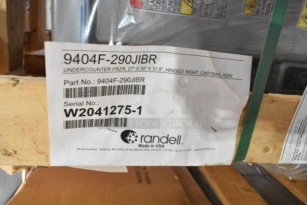 Brand new Randell 9404F-290JIBR stainless steel undercounter freezer in crate. Label shows model, part, and serial numbers.