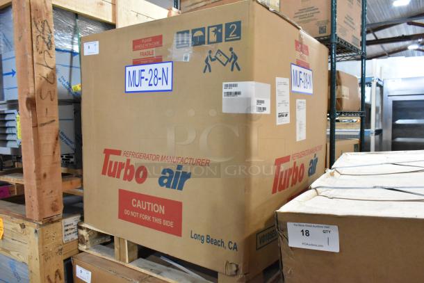 Brand new Turbo Air MUF-28-N stainless steel undercounter freezer in box, model and handling labels visible.