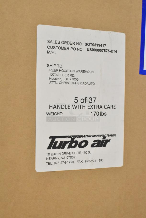 Alt Text: Cardboard box for Turbo Air MUF-28-N single door undercounter freezer, showing shipping label and handling instructions.