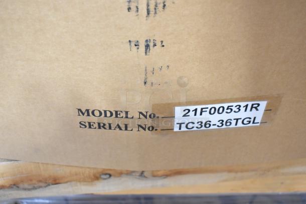 Brand new Therma-Tek TC36-36TGL stainless steel griddle in box. Model 21F00531R. Serial label shown.