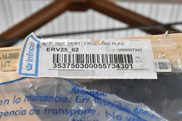 Brand new Infrico ERV25-GD 2-door cooler in crate. Label shows model ERV25_62, serial 3000557343, 115V, 1 phase.