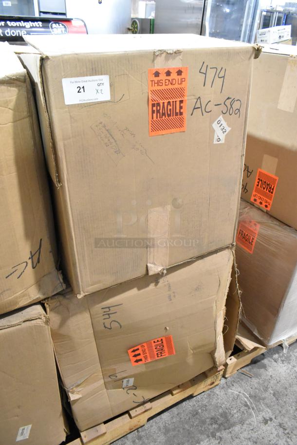 Two unopened Hoffmann N170116G010 Spectracool units in boxes, 1025 BTU, 110/115V, "fragile" labels, Practica STI-10101.