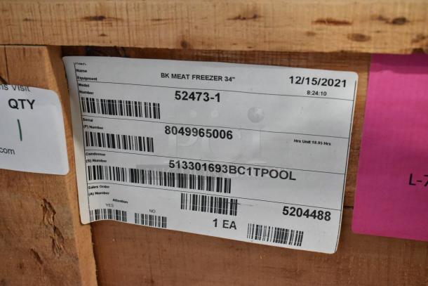 Brand new in crate, 2021 BKI 52473-1 stainless steel commercial meat freezer label. Model, serial, and order details visible.