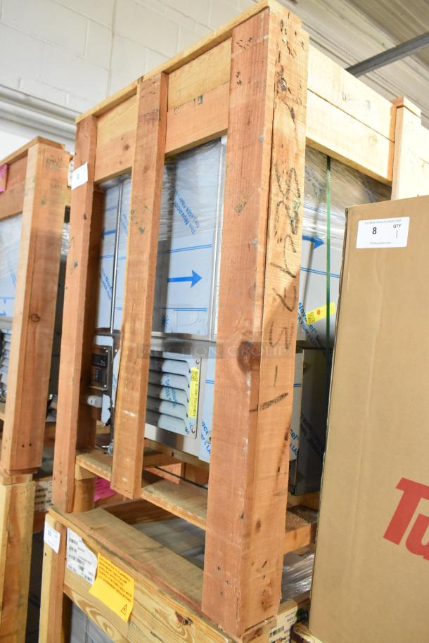 Brand new BKI 52473-1 stainless steel commercial meat freezer in a wooden crate, on casters, 115V, 1 phase.