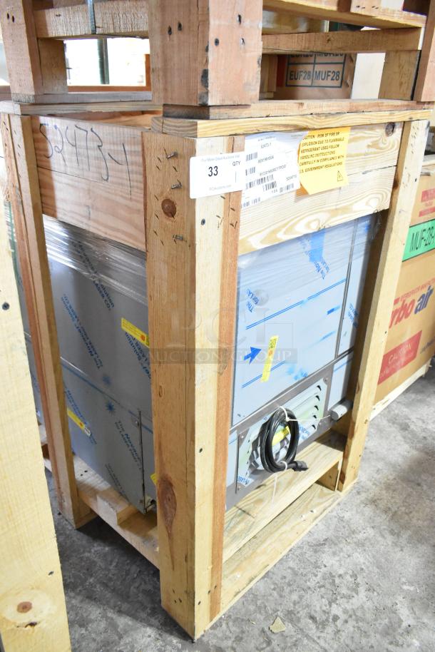 BRAND NEW 2022 BKI 52473-1 stainless steel meat freezer in crate, on commercial casters, 115V, 1 phase, visible labeling.