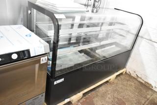 Brand new Avantco 193BC72HCB curved glass bakery display case, black, with visible glass damage. 115 volts, 1 phase.