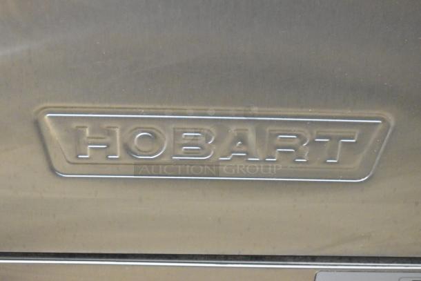 Stainless steel Hobart LXNH undercounter dishwasher, brand new with minor scratches and dents, high temperature model.