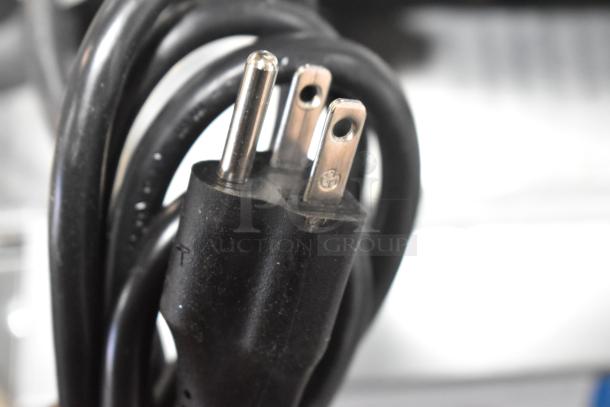 Close-up of a 115V power plug for a Hobart Centerline EDGE10-11 meat slicer, showcasing prongs and cord detail.