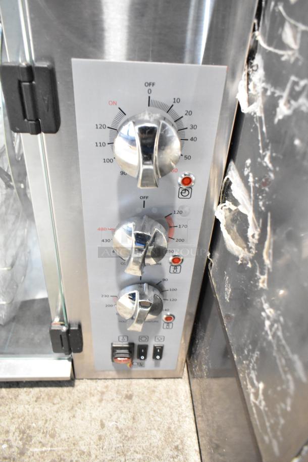 BRAND NEW Cooking Performance Group CROE415D electric rotisserie oven. Scratch and dent condition. Dials for temperature control.