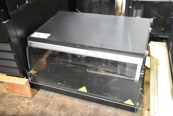 Brand new Avantco 177OAM1A 26" black countertop merchandiser with LED lighting, scratch and dent, broken glass visible.