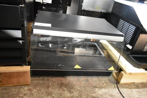 Brand new Avantco 177OAM1A 26" black countertop merchandiser with LED lighting, one shelf, and broken glass. 120V, 1 phase.