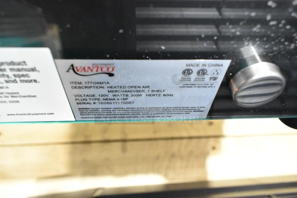 Avantco 177OAM1A merchandiser tag showing model, voltage, wattage, and plug type. Indications of a scratch and dent item.