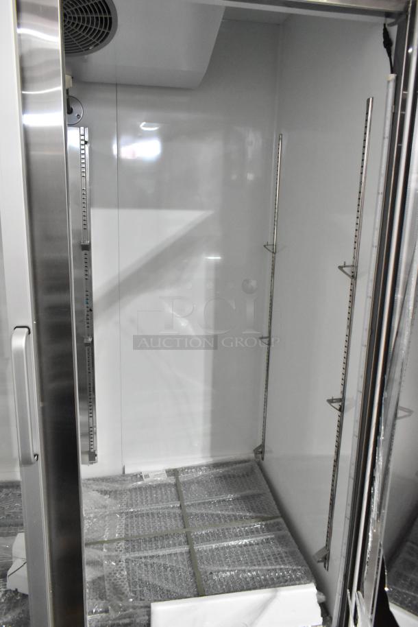 Brand new Avantco 178A49RGHC 54" glass door refrigerator, interior view showing shelving, with noted glass damage.