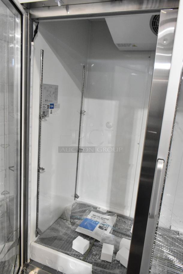 Brand new Avantco 178A49RGHC 54" glass door reach-in refrigerator, minor glass damage visible, 115V, 1 phase.