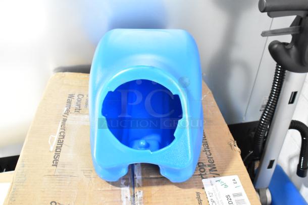 Blue plastic casing for Lavex 274AFS3BAT floor scrubber on a cardboard box; visible scratch and dent sign.