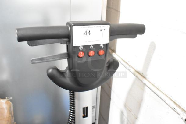 BRAND NEW Lavex 274AFS3BAT 13" AGM Cordless Floor Scrubber handle with visible controls and auction label.