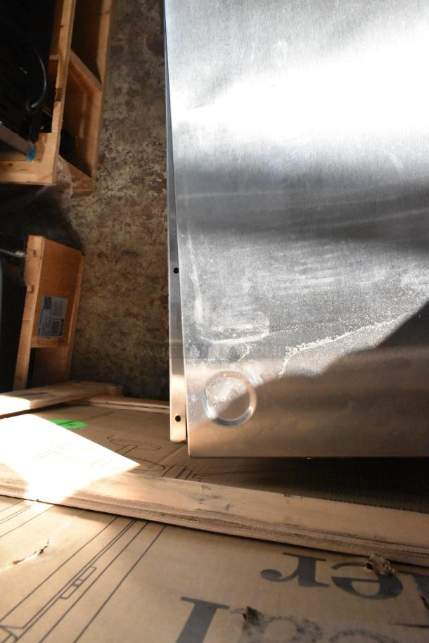 Brand new Avantco 177DPO18DS stainless steel double deck pizza oven, 240V, with visible dents on the surface.