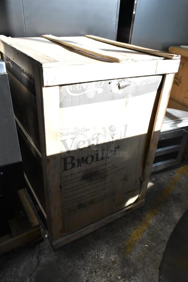 Brand new Avantco 177VB203 stainless steel gas vertical broiler in original packaging, 65 lb. capacity, 28,500 BTU.