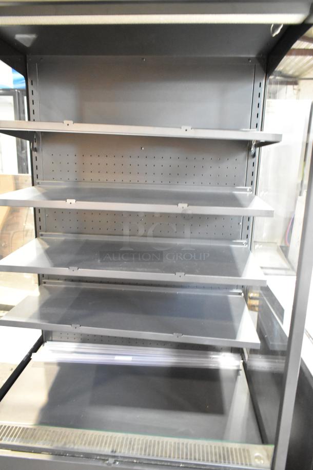 Brand new Avantco 193VOA36B 35 3/8" black vertical open air merchandiser with LED lighting, scratch and dent, on casters.