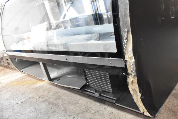 Brand new Avantco 178DLC82HCS black curved glass refrigerated deli case, 82", 115V, scratch and dent visible on corner.