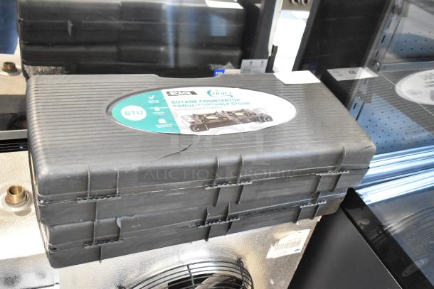 2-Burner AvaTek 334PCS40 Butane Stove, 16,000 BTU, new, in black case with brass burners, labeled "Choice 472BR23600."