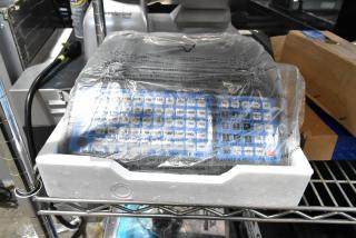 Brand new AvaWeigh 334PCS60T 60 lb. digital price computing scale, protective wrap, minor scratches, dent visible.