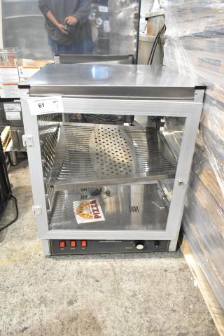 Brand new Carnival King 18" warmer, model 382HPW18D2S. Scratch and dent. Doors do not latch. 120V, 1 phase.