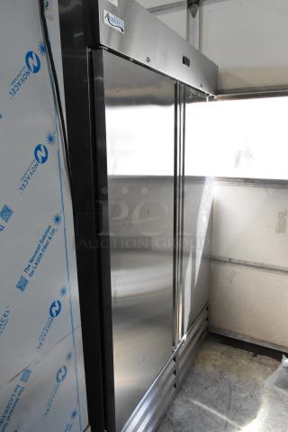 BRAND NEW SCRATCH AND DENT! 2025 Avantco 447AP49R Stainless Steel Commercial 2 Door Reach In Cooler w/ Poly Coated Racks and Commercial Casters. 115 Volts, 1 Phase. - Item #1204967