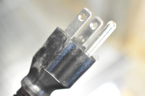 Close-up of a three-prong plug for the Avantco 178SS1RGHC commercial cooler, indicating 115 Volts, 1 Phase.