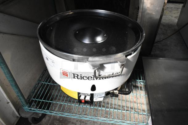RiceMaster RM-55N-R gas rice cooker, 110 cup capacity, 34,600 BTU, new with minor dents, visible branding and control panel.