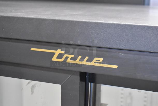 True GDM-41SL-54-LD cooler merchandiser with poly coated racks and branded logo. 2 doors, metal finish, 115 volts, 1 phase.