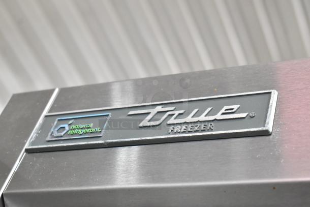 2018 True T-19F-HC stainless steel commercial freezer with natural refrigerant label, poly coated racks, 115 volts, 1 phase.