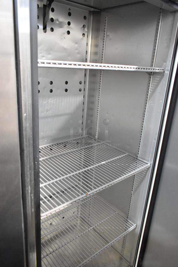 2018 True T-19F-HC stainless steel commercial freezer with poly-coated racks, single door, visible interior.