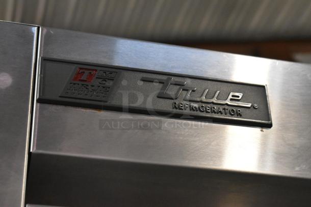 2016 True T-35 stainless steel commercial cooler, 2-door, poly coated racks, left door locked, 115V, 1 phase.