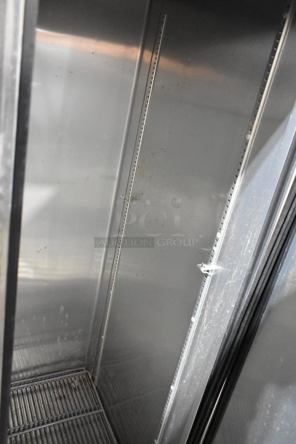 2016 True T-35 Stainless Steel 2 Door Cooler, poly racks, left door locked, 115V, 1 Phase, interior view.