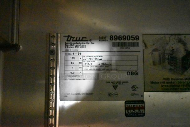 2016 True T-35 stainless steel commercial cooler label. Model T-35, 115V, 1 phase, with poly coated racks. Left door locked.