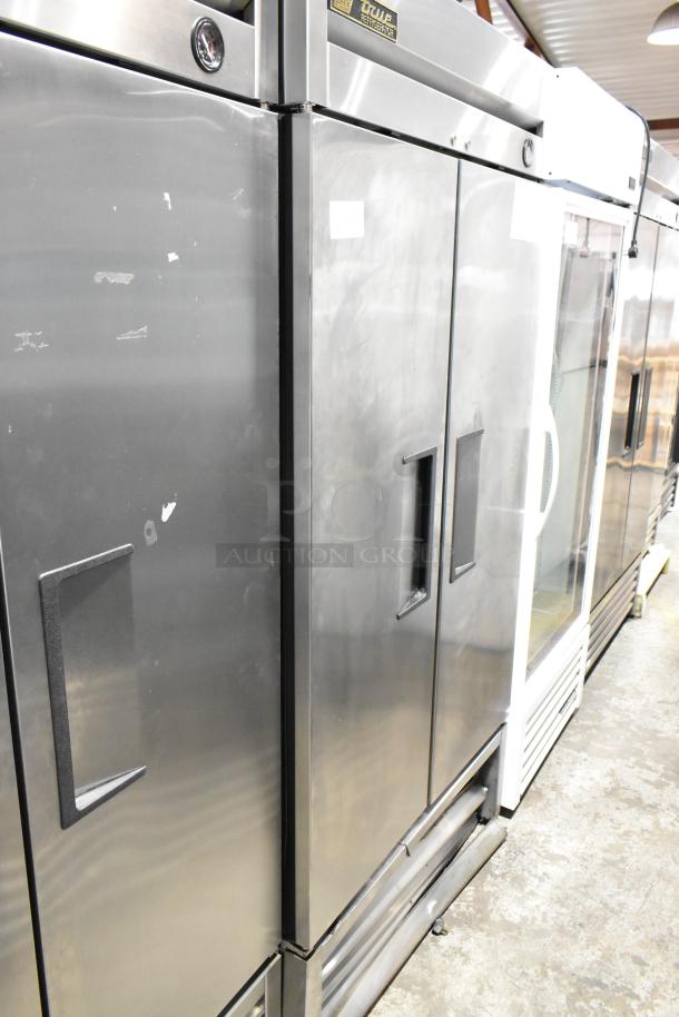 True T-35 stainless steel 2-door commercial cooler, 115V, 1 phase, poly-coated racks, used condition with visible wear.