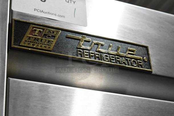 True T-35 Stainless Steel 2 Door Reach In Cooler, 115V, 1 Phase, with poly-coated racks. True logo plate shown.