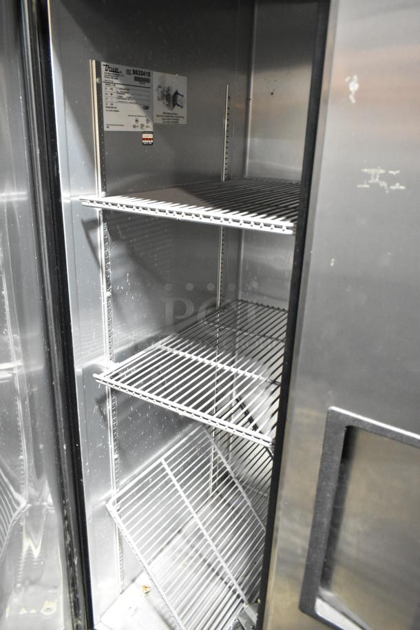 True T-35 stainless steel 2-door commercial reach-in cooler with poly-coated racks, interior view, 115V, 1 phase.